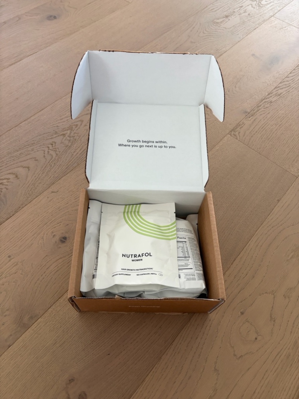 Nutrafol Daily Supplement Sachets in White & Light Green